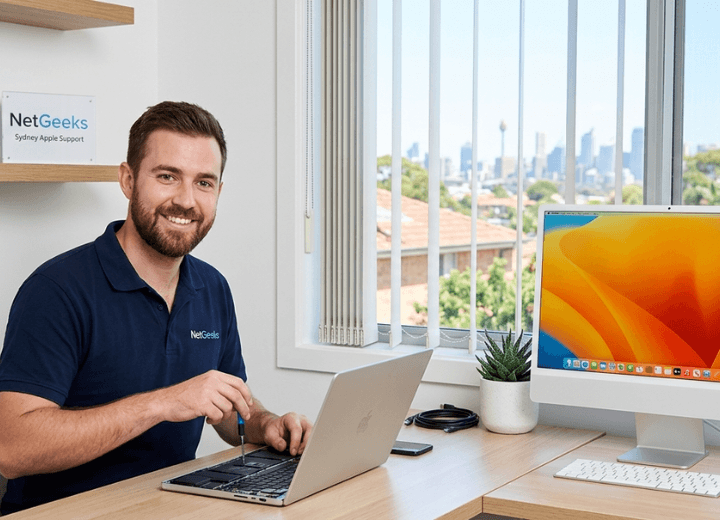 Technician helping with MacBook and iMac support